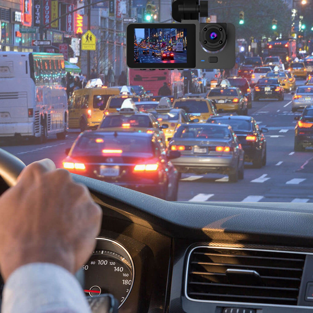 Car dashboard with a camera recording a busy city street