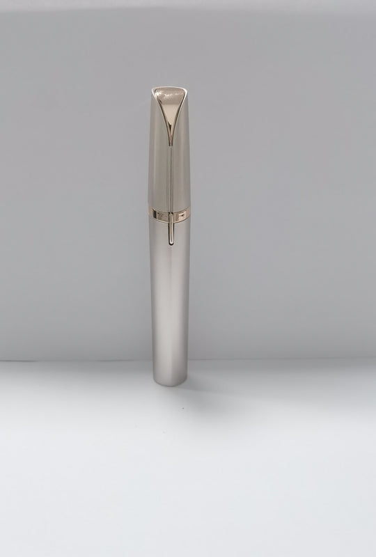 Silver pen with rose gold accents on a light gray background