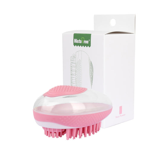 Pink and white grooming brush with &