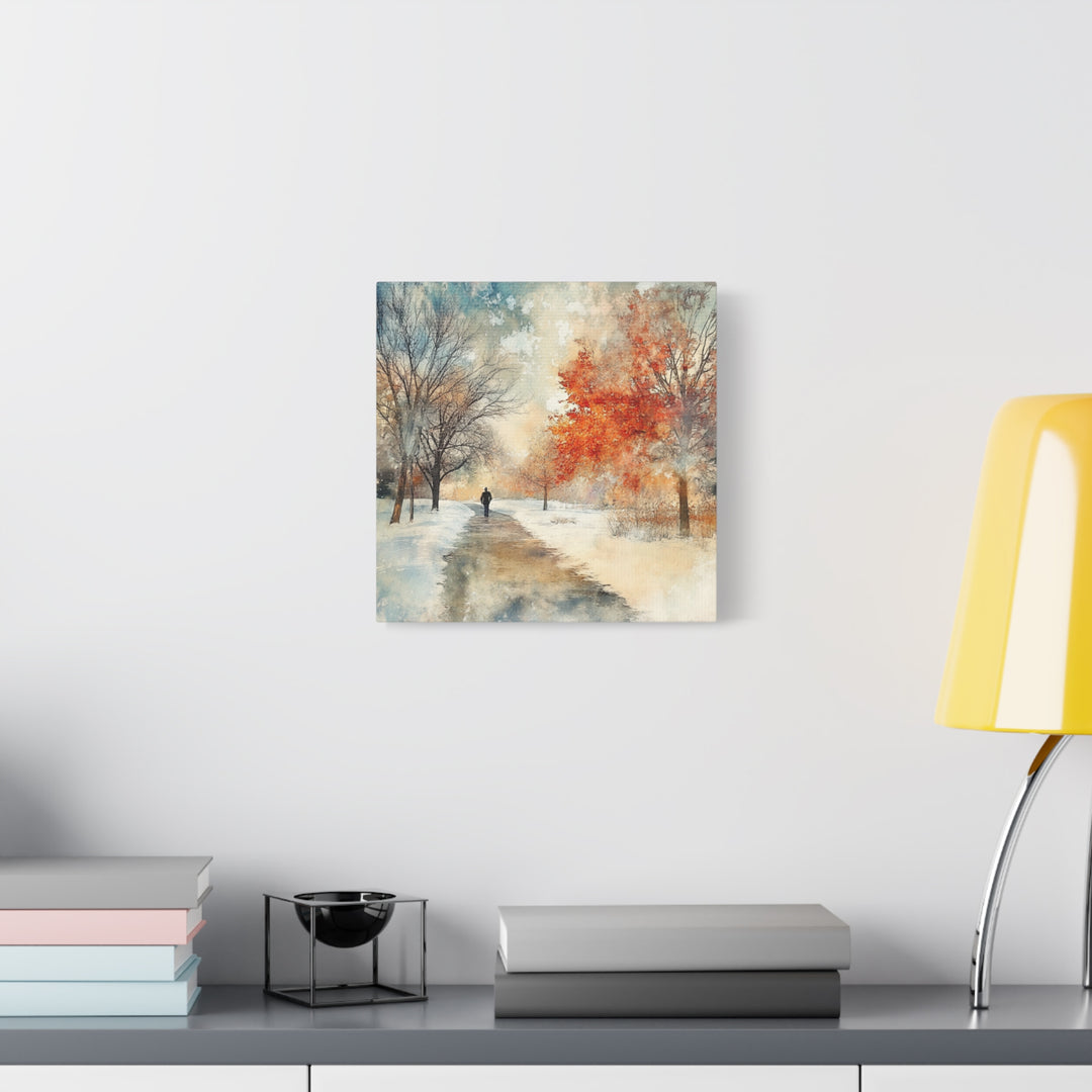 Abstract landscape painting on a wall above a desk with books and a lamp.