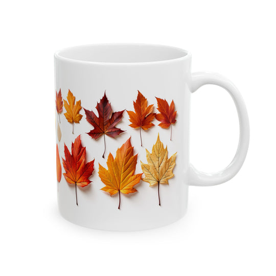 White mug with autumn leaf design on a white background