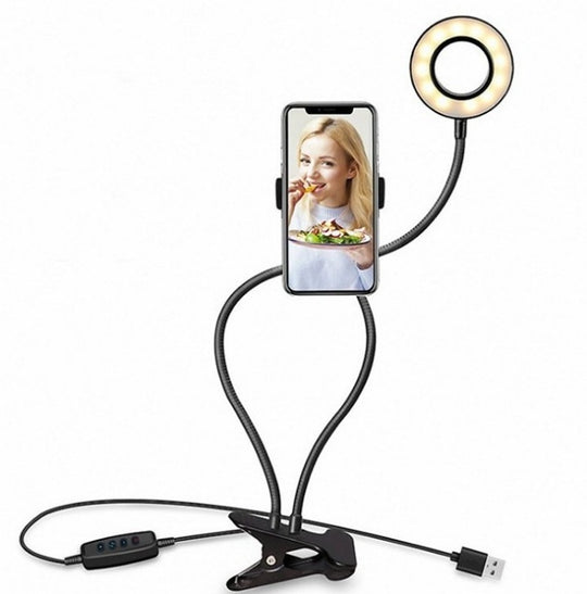 Phone holder with ring light and USB cable on a white background