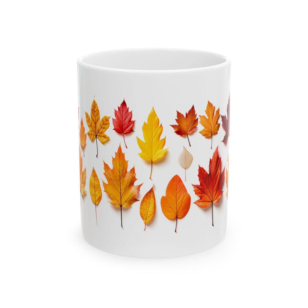 White mug with autumn leaf design on a white background