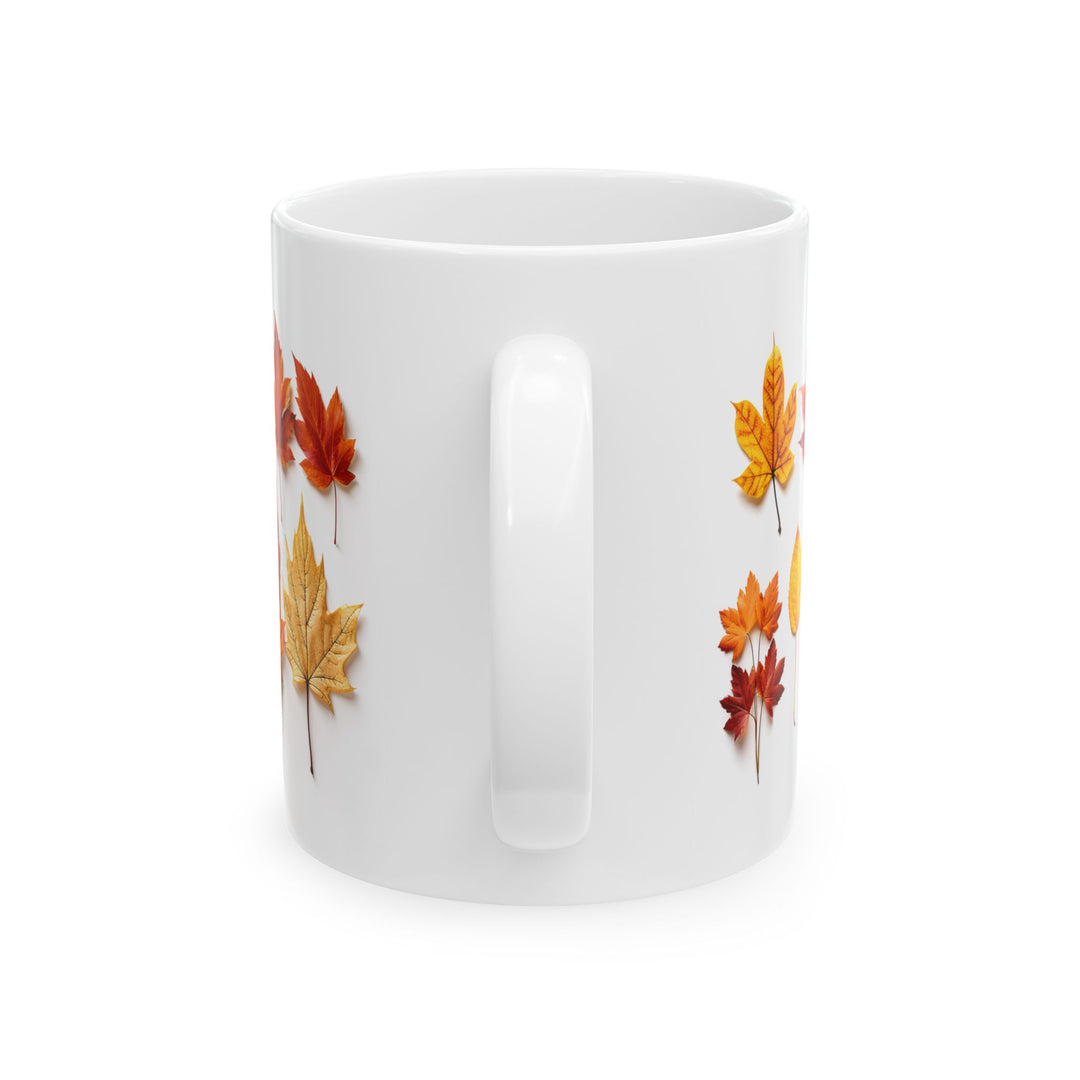 White mug with autumn leaf pattern on a white background