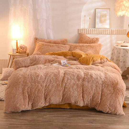 Fluffy beige comforter on a bed in a cozy bedroom setting.