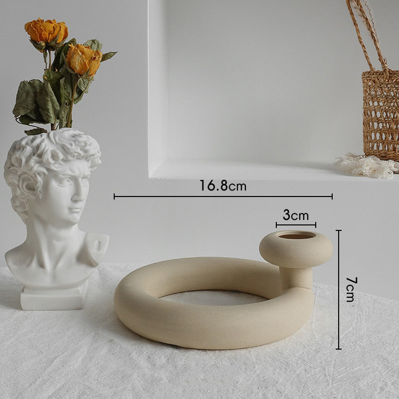 Ceramic ring-shaped object with measurements on a neutral background