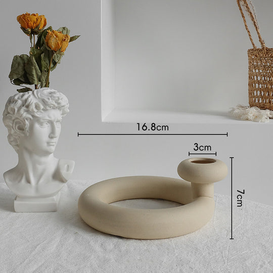 Ceramic ring-shaped object with measurements on a neutral background