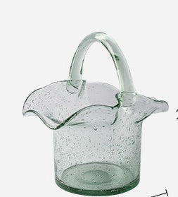 Clear glass pitcher with handle on a white background