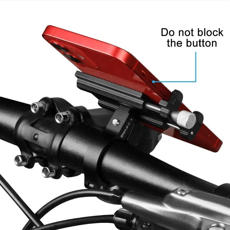 Red phone mount on a motorcycle handlebar with text indicating not to block the button.