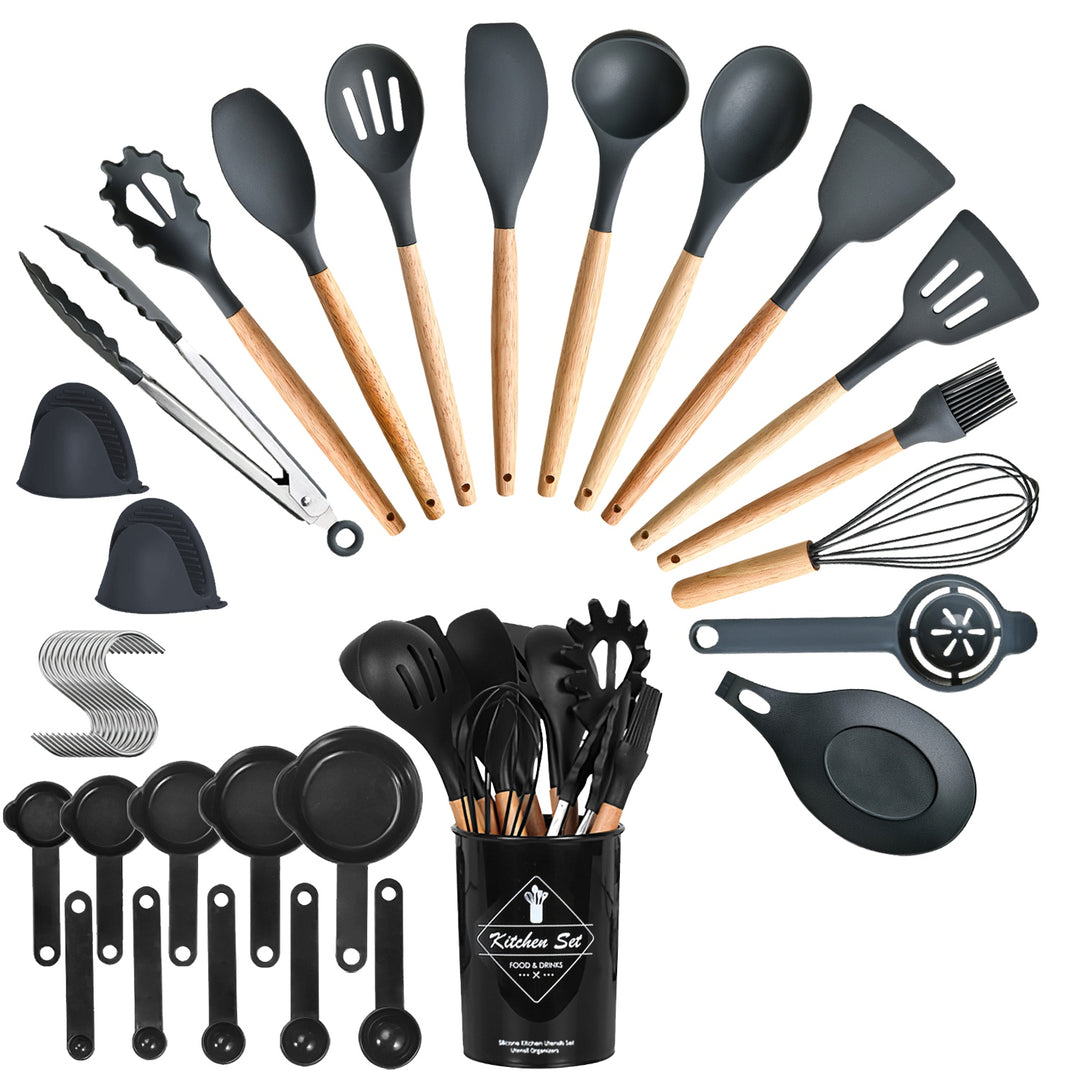 Set of kitchen utensils including spatulas, spoons, and whisks with a black container labeled &