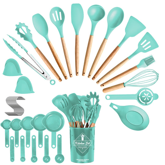 Set of turquoise kitchen utensils with wooden handles in a green container on a white background