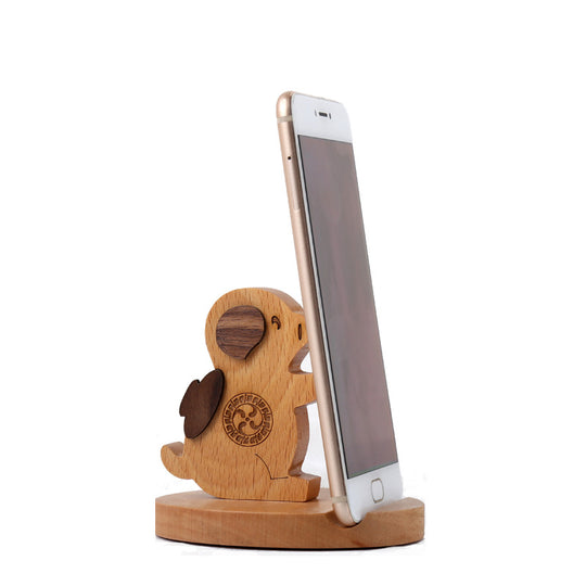 Wooden phone stand with a smartphone on a white background