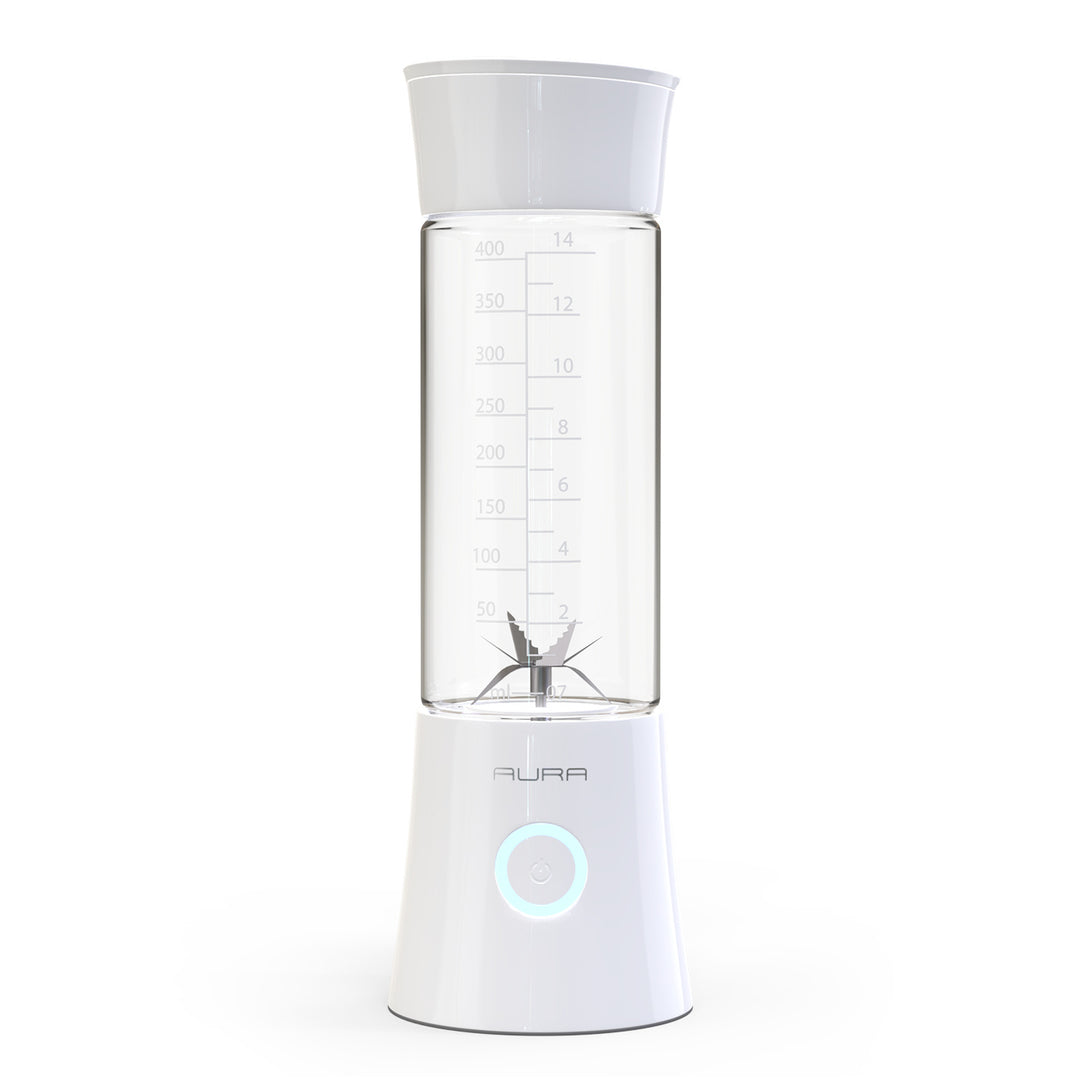 Clear blender with white base and lid on a white background