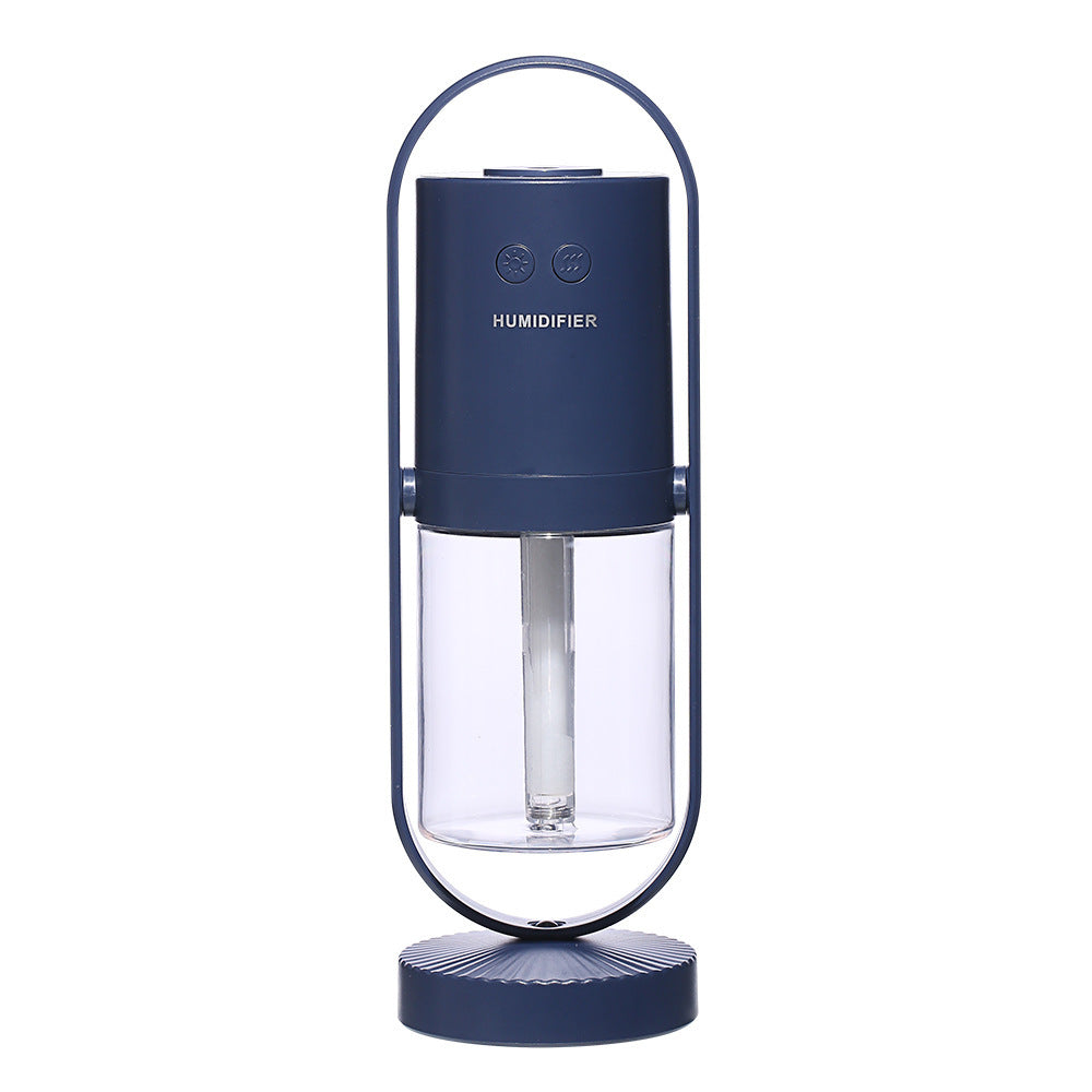 Blue humidifier with clear water tank on a white background