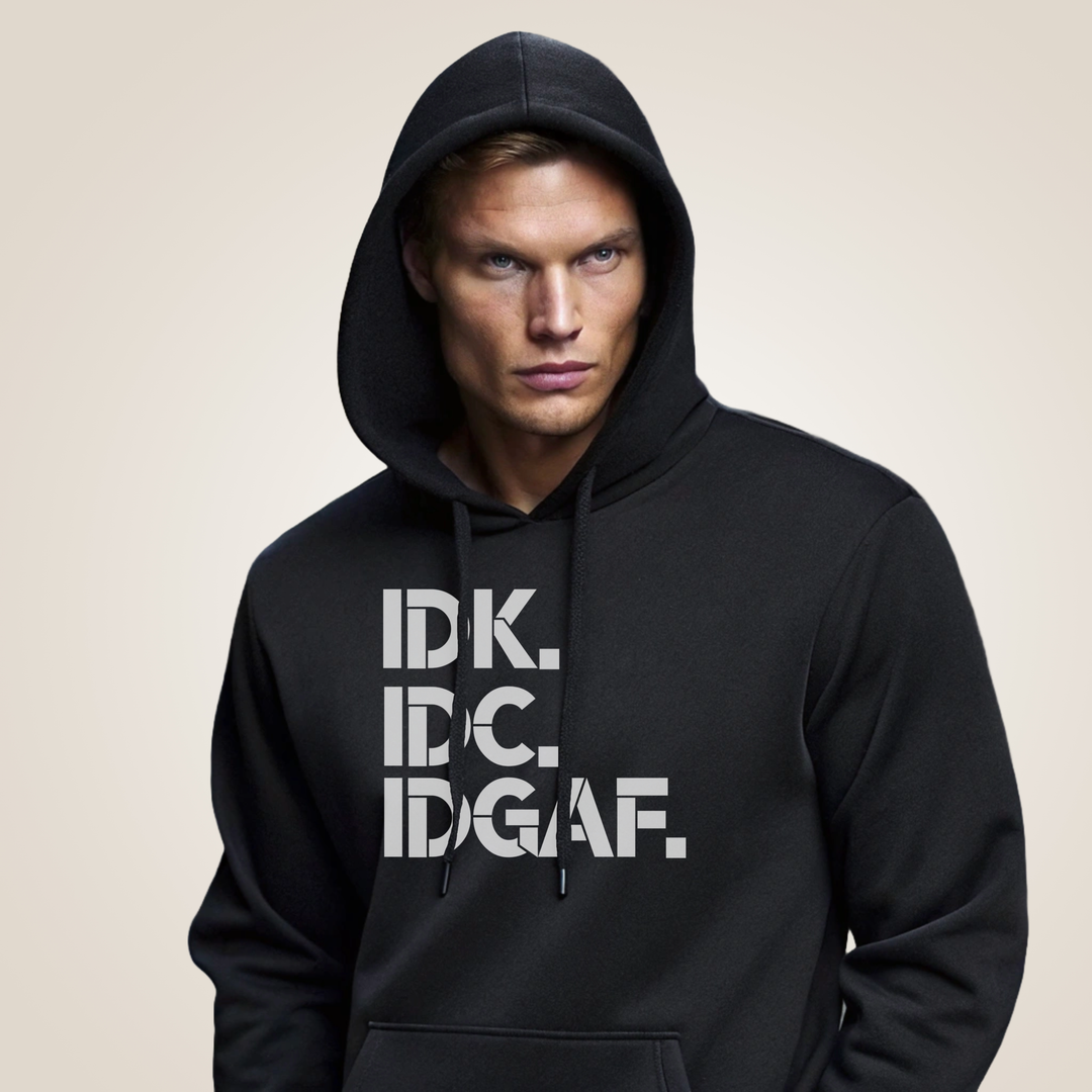 Man wearing a black hoodie with text on a beige background