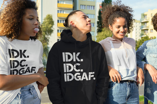 Four young people wearing t-shirts with &