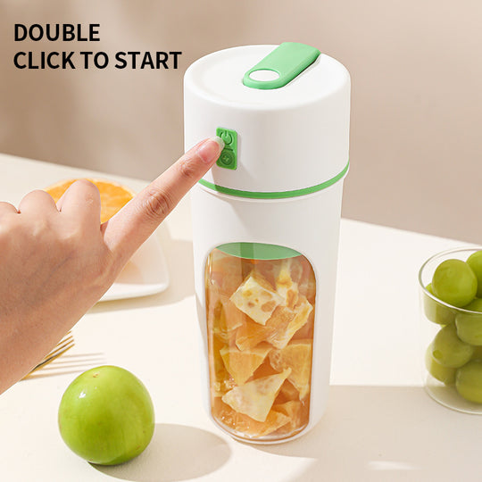 Hand pressing a button on a white and green fruit infuser bottle with fruits around.