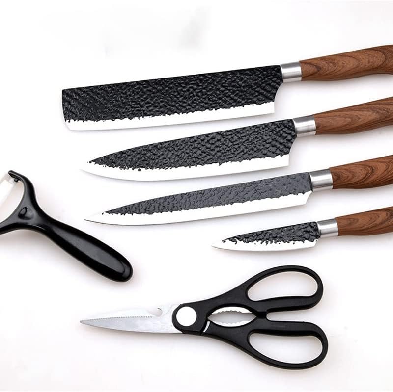 Set of knives and a pair of scissors on a white background
