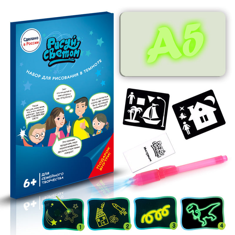 Darkroom drawing set with glow-in-the-dark paper, pen, and templates on a white background