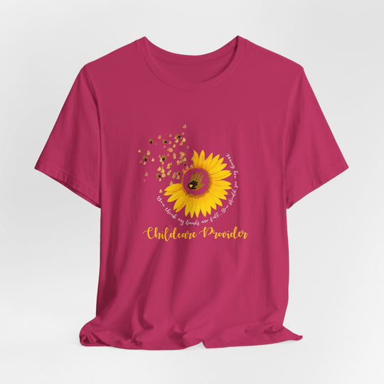 Pink t-shirt with a sunflower graphic and text on a white background
