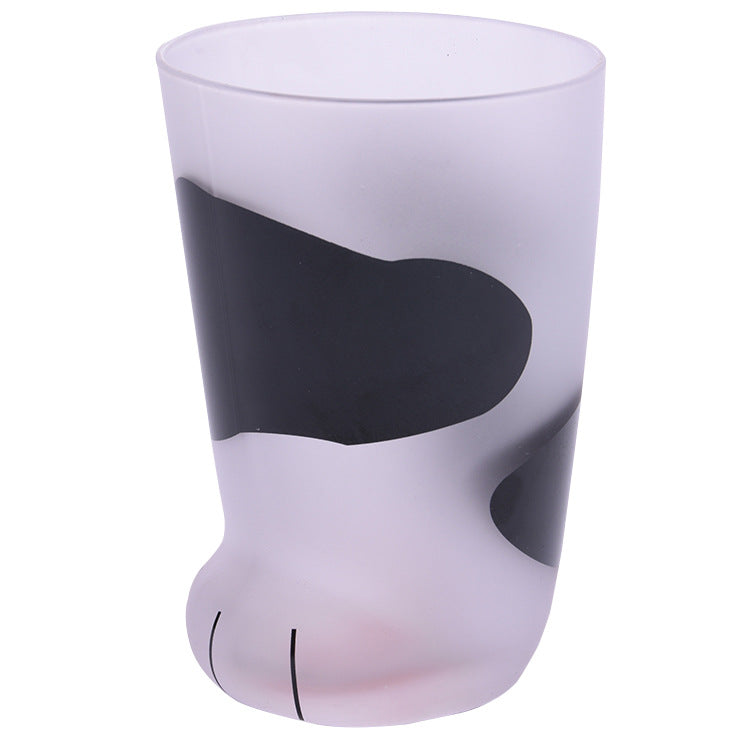Glass with a cat paw design on a white background