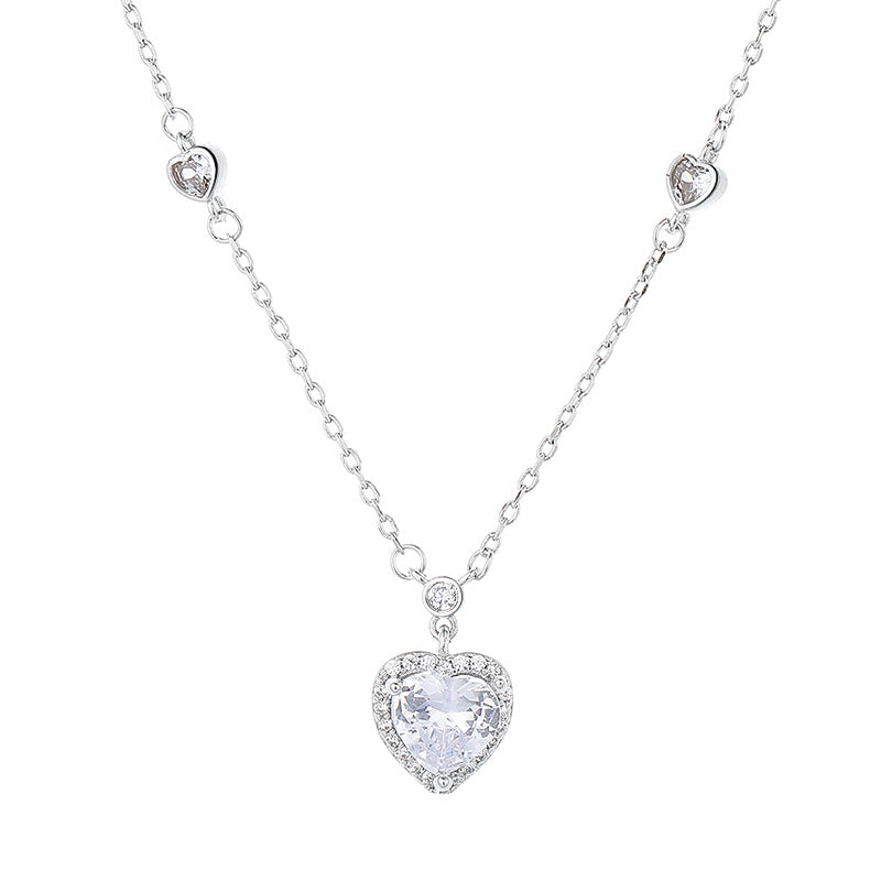 Heart-shaped crystal pendant necklace on a white background