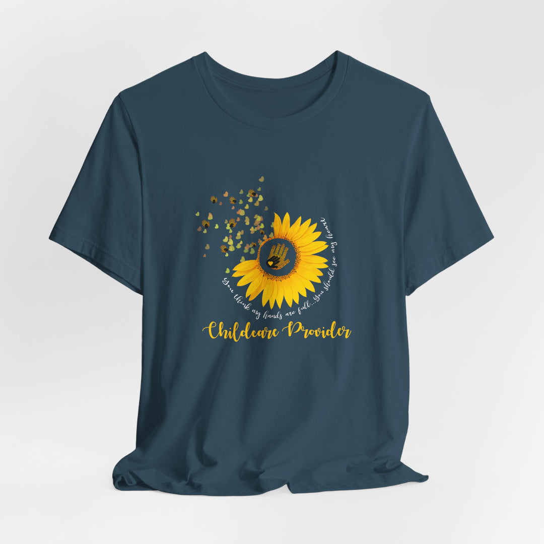 Navy blue t-shirt with a sunflower graphic and text on a light gray background