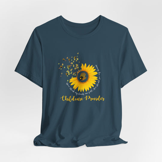Navy blue t-shirt with a sunflower graphic and text on a light gray background