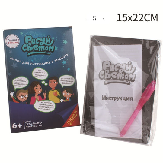 Dark blue packaging with illustrations and text, showing a pen and paper set with clear cover on a white background.