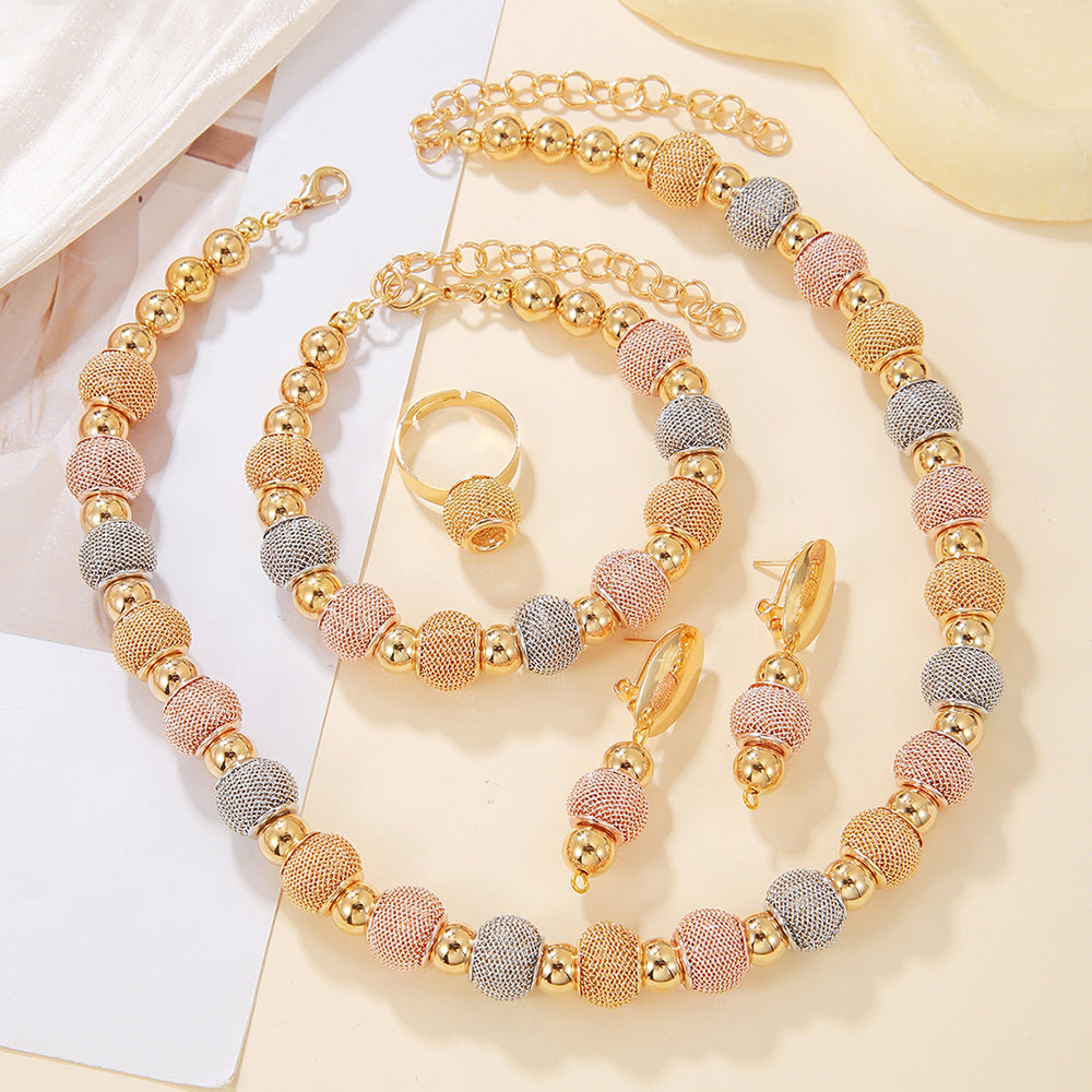 Gold plated beaded jewelry set for women featuring a necklace, bracelet, and earrings in a stylish fashion design.