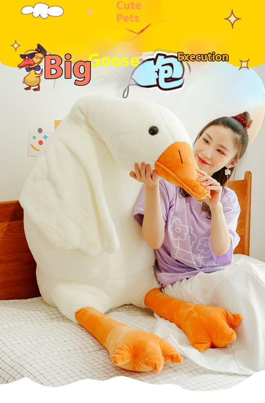 Person holding a large plush goose toy with text on a yellow background