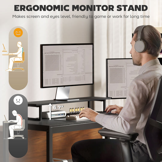 Ergonomic monitor stand being used by a person at a desk with two monitors.