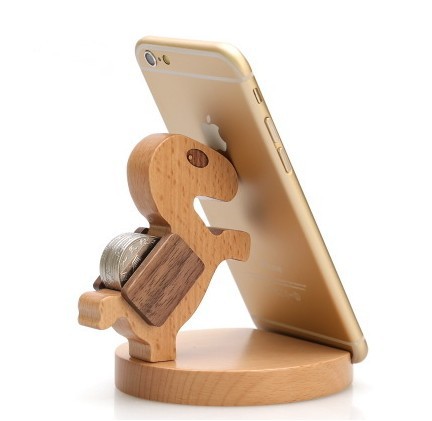 Wooden phone stand holding a smartphone on a white background