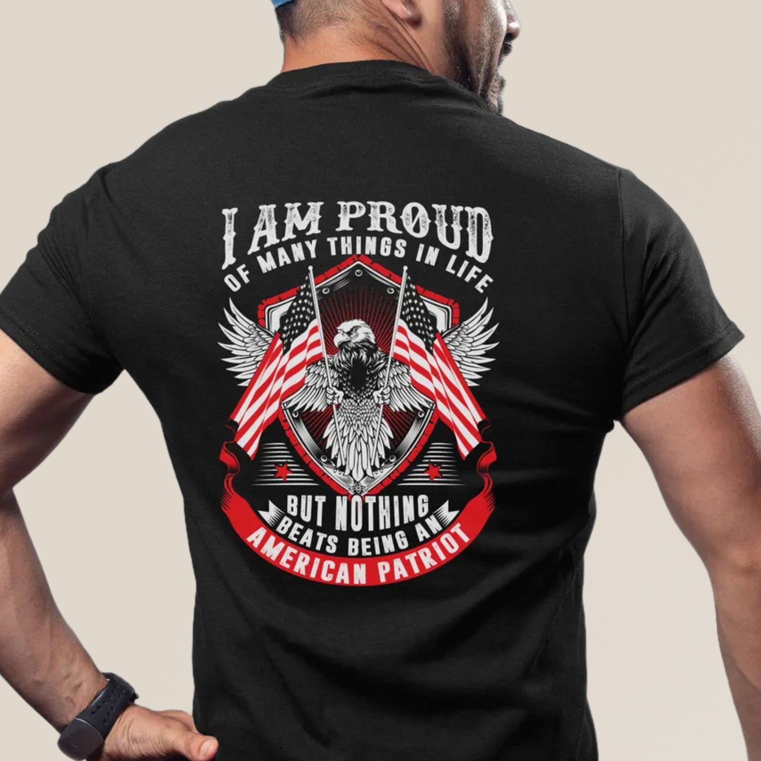 Person wearing a black t-shirt with an eagle and American flag design on the back.