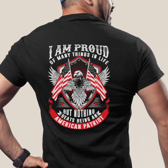 Person wearing a black t-shirt with an eagle and American flag design on the back.