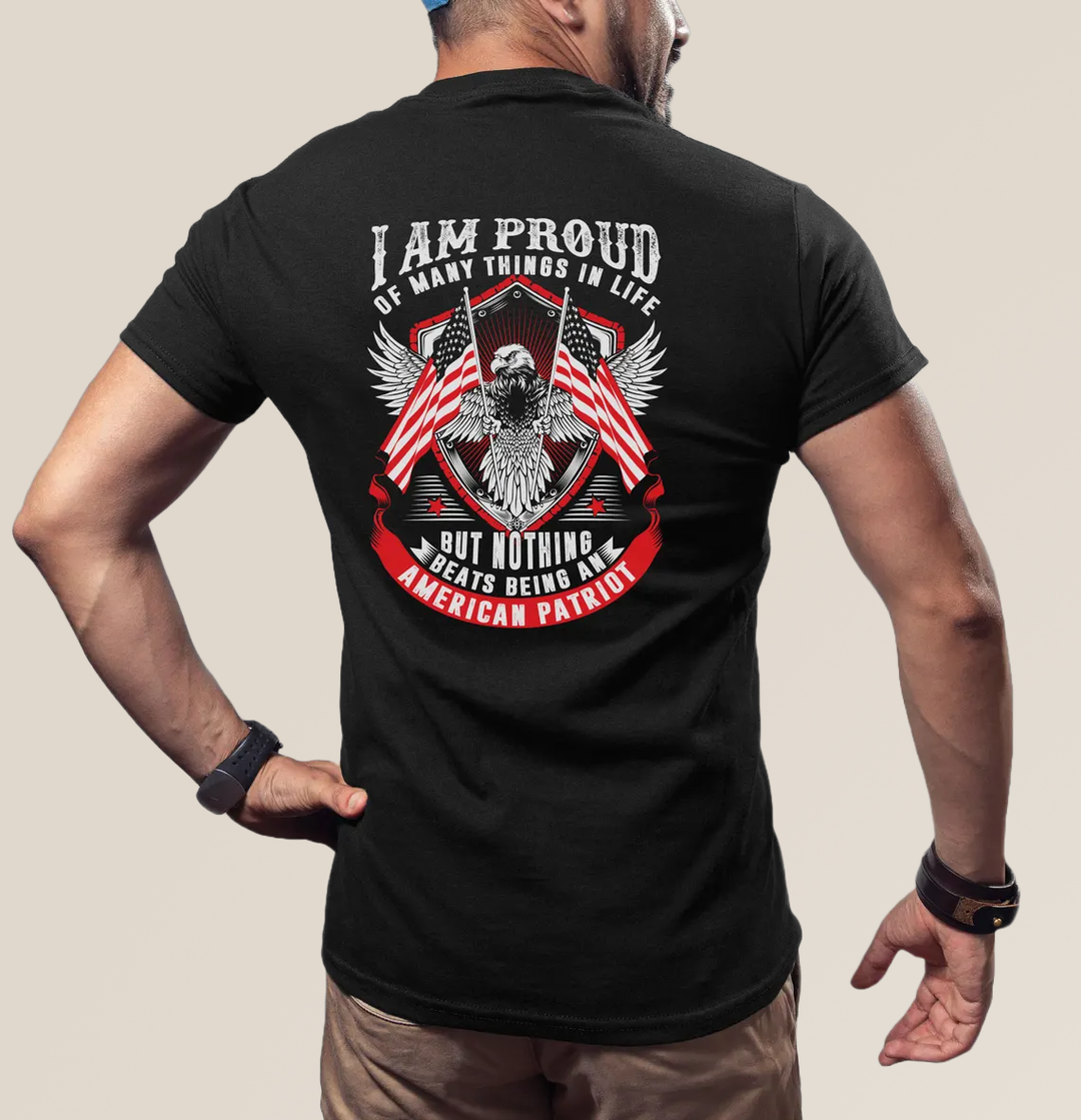 Person wearing a black t-shirt with an eagle and American flag design on the back.