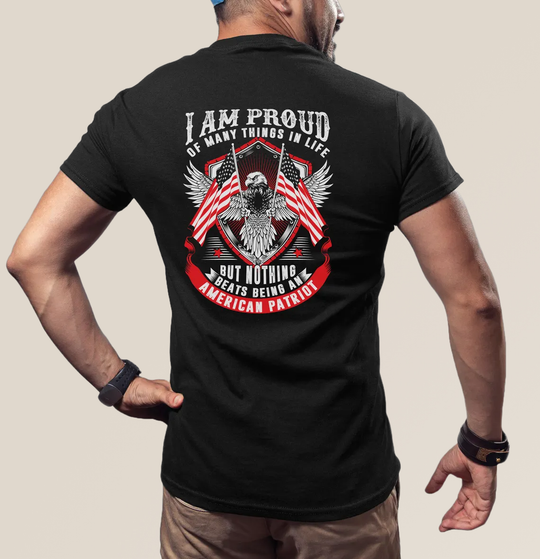 Person wearing a black t-shirt with an eagle and American flag design on the back.