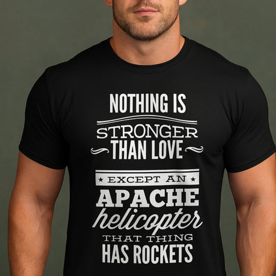 Black t-shirt with white text worn by a person on a dark background