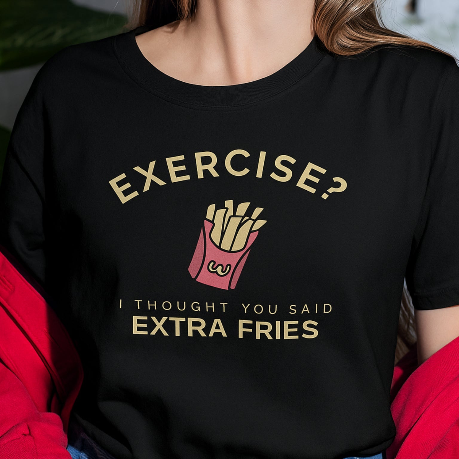 Person wearing a black t-shirt with a humorous French fry graphic and text.