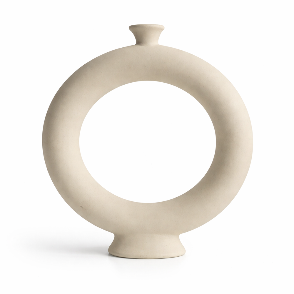 Beige ceramic vase with circular design on a white background