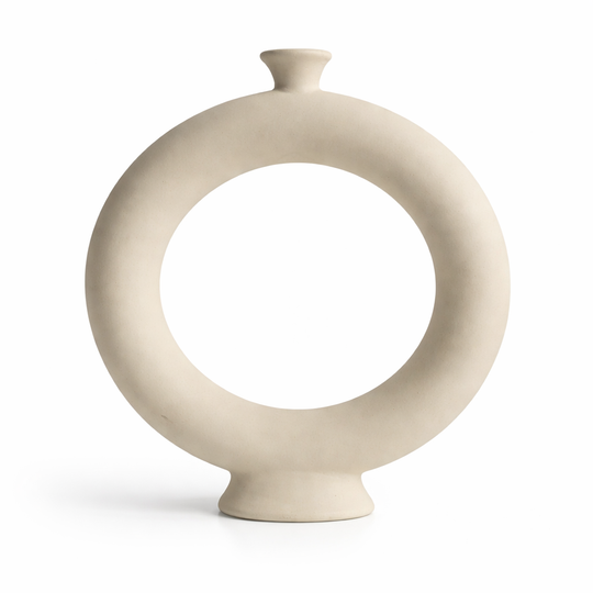 Beige ceramic vase with circular design on a white background