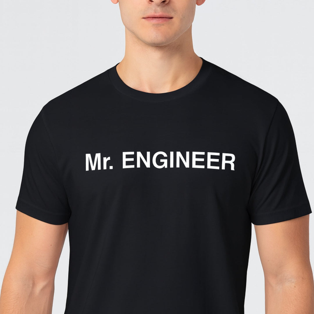 Person wearing a black t-shirt with 'Mr. ENGINEER' text on a light gray background