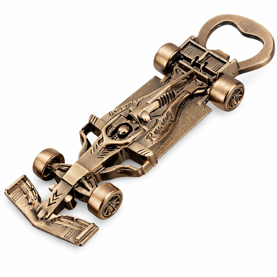 Bronze car-shaped bottle opener on a white background