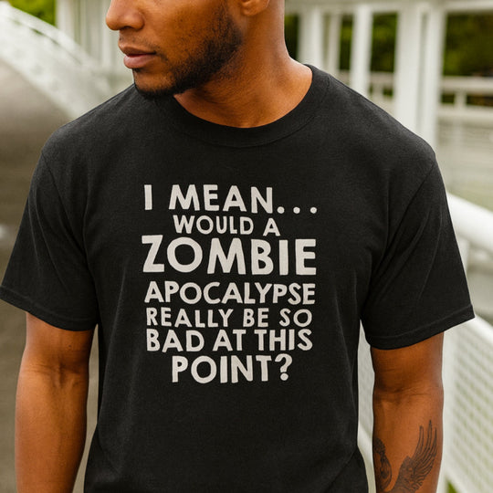 Person wearing a black t-shirt with a humorous zombie apocalypse joke on a bridge background