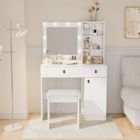 White vanity table with mirror and lights in a bedroom setting