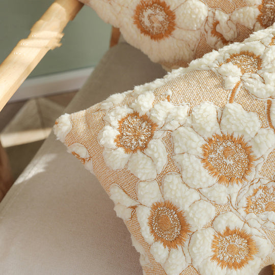 Close-up of floral-patterned cushions with a blurred background