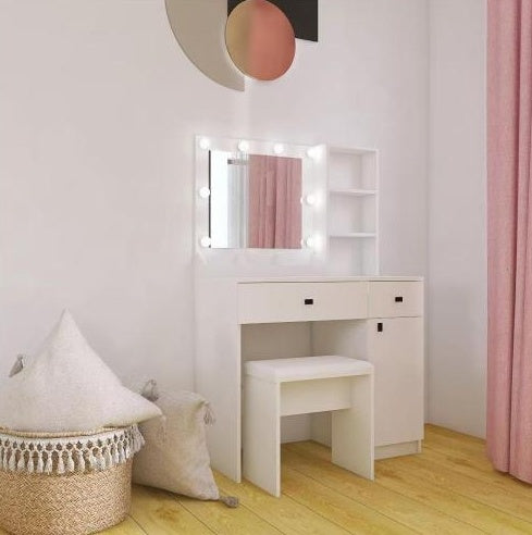 White vanity table with mirror and lights in a room with pink curtains and a white wall.