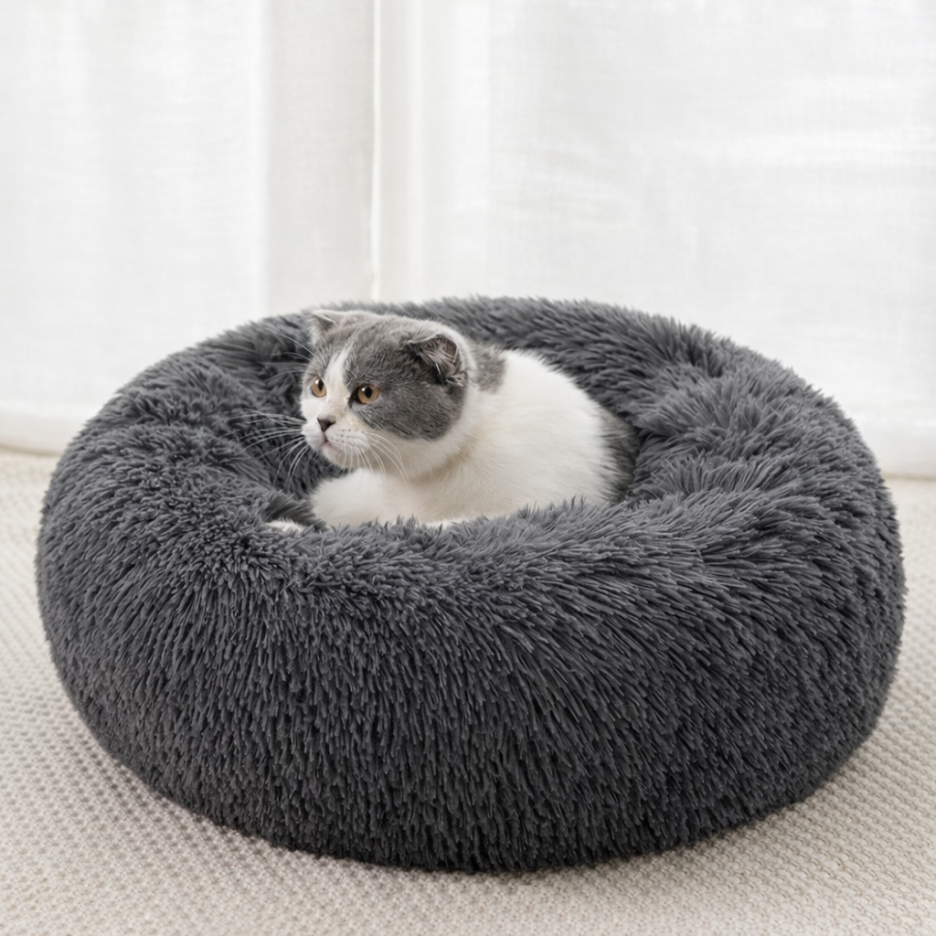 Gray plush calming pet bed with a cat resting inside