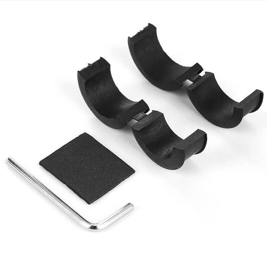 Set of black plastic components and a silver tool on a white background