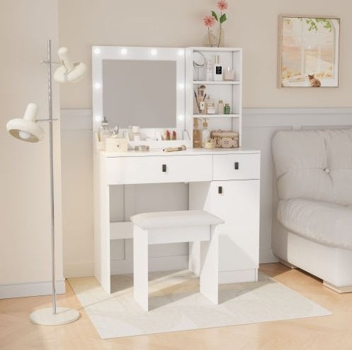 White vanity table with mirror and stool in a room setting